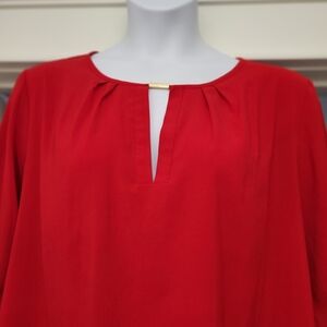 Calvin Klein 18W red dressy high/low blouse, with gold bar accent.